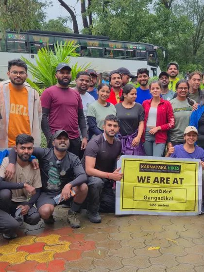 Our group proudly holding the banner at the start of the Gangadikal trek.