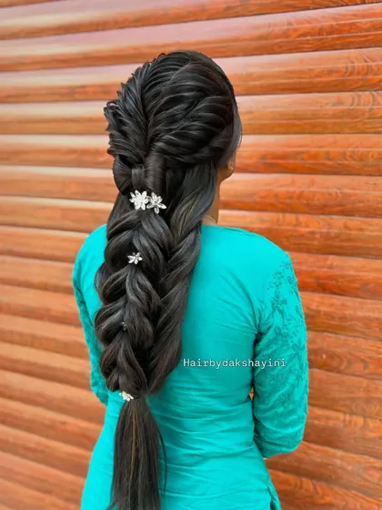 A side view showcasing the braid's texture and how the accessories are placed within the weave.