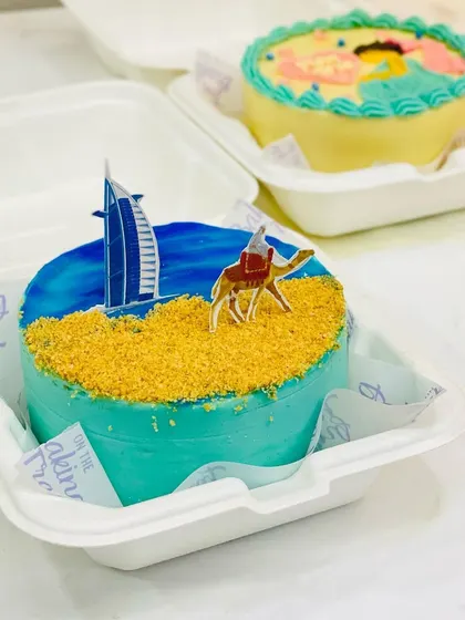 A Dubai-themed bento cake for someone dreaming of or celebrating a trip. The biscuit crumble sand is one of my favorite details.