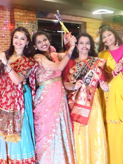 A group of friends enjoying the dandiya night. My events are a great way for people to socialize and celebrate festivals together.