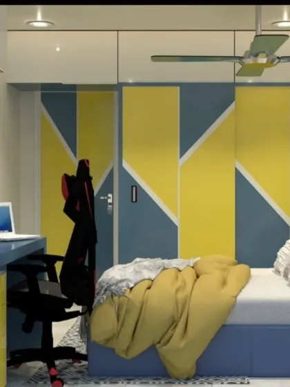 This angle shows the clever design of the wardrobe doors and the gaming chair at the desk.