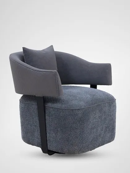 The swivel base allows for 360-degree movement, making this armchair a versatile and functional piece for a living room or study.