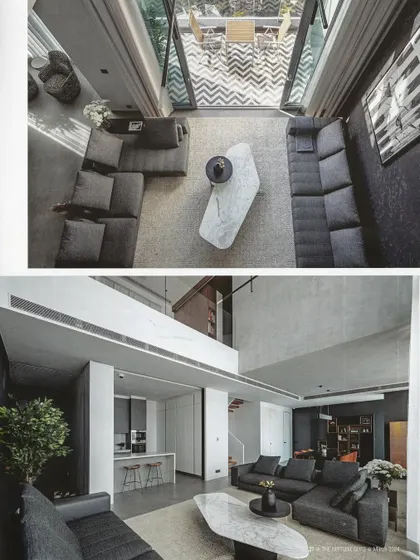 An aerial view of the living room, showing the open-to-sky balcony and the seamless connection between the indoor and outdoor spaces.