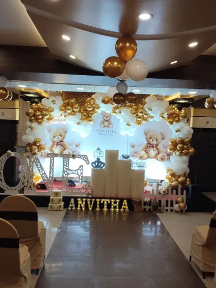 A classic and elegant teddy bear theme for a first birthday celebration. My team designed the entire stage, including the "ONE" marquee lights, backdrop, and coordinated balloon decor.