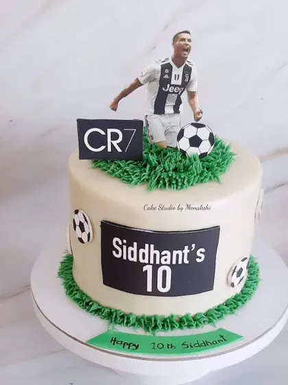 A cake for a Ronaldo lover, featuring a CR7 figure and a buttercream grass field. A great choice for any football fan's birthday.