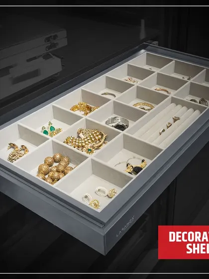 This decorative shelf is a dedicated space for your most treasured jewellery. The soft, sectioned tray prevents tangles and scratches, keeping your collection safe and beautifully displayed.