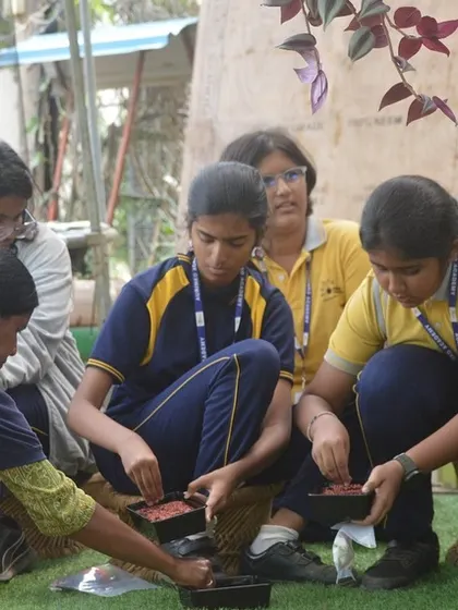 It all starts with a seed. Students get their hands dirty during a planting workshop, learning the basics of sowing and nurturing, an essential skill for any future gardener.