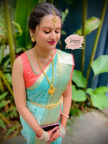 A beautiful and natural makeover for the sister of the bride. This look is perfect for a Muhurtham, with soft makeup that enhances her features without being overpowering.