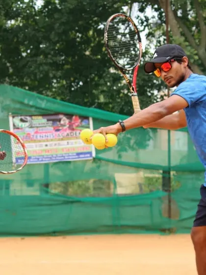 Technique is everything. We provide hands-on coaching to break down every aspect of a shot, like demonstrating the correct grip and swing path for a powerful forehand.