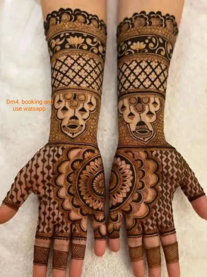 A traditional design with mandala patterns on the palms and kalash (pot) motifs on the arms. I am available for all types of mehndi, including bridal, Indian, and 3D.