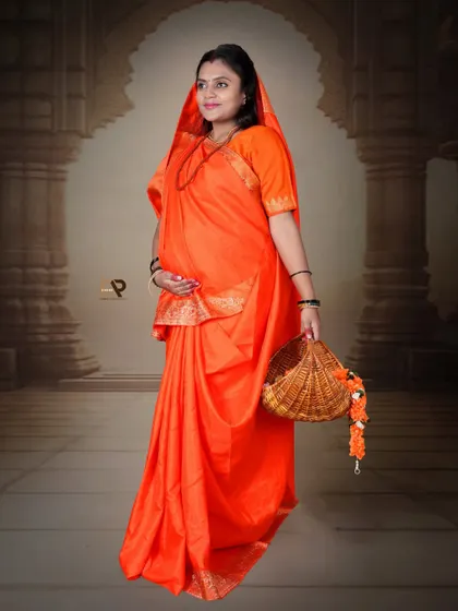 A graceful solo portrait from our Seetha-Ram theme. The mom-to-be holds a basket, her orange saree glowing against the artistic backdrop.
