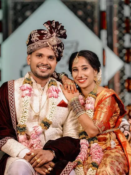 A happy couple portrait from their wedding reception, showcasing their elegant evening attire.