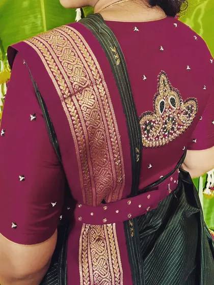 A unique touch for a special bride. This blouse features a hand-embroidered crown motif on the back, a little detail to make her feel like the queen that she is on her wedding day.