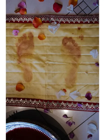 The Griha Pravesh ceremony leaves a lasting mark. Shaan's footprints, imprinted on a cloth after stepping in colored water, will be kept as a beautiful memento of her first steps into her new home.