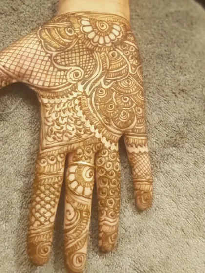 A classic Indian mehendi design covering the palm with a variety of textures and motifs.