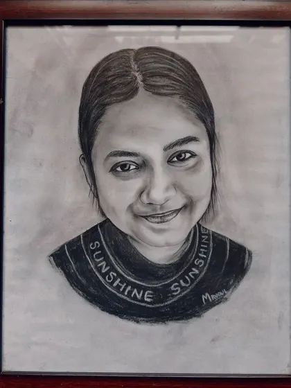 An example of a framed charcoal portrait. The right frame complements the artwork, turning a beautiful sketch into a timeless piece of decor for your home.
