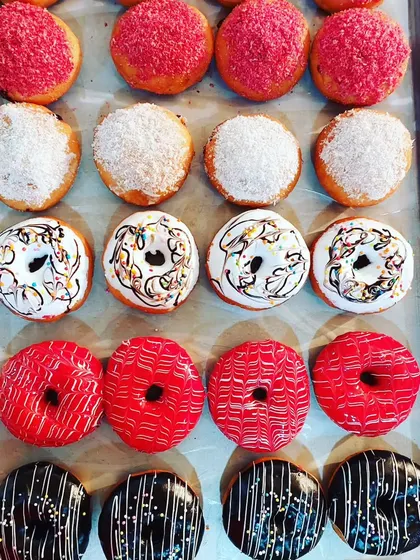 A tray of colorful and delicious donuts made in our baking diploma course. You will learn how to make the dough, fry it to perfection, and create a variety of glazes and toppings.