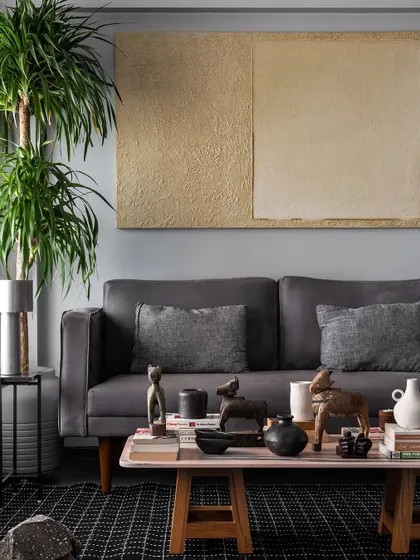 This living room setting shows a sofa I designed for comfort and style. Paired with a custom coffee table, it creates a welcoming space for family and guests to gather.