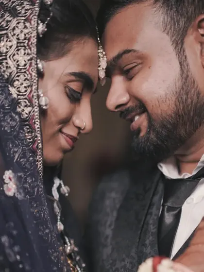 An intimate close-up of the couple, forehead to forehead. This shot is all about capturing the deep connection and love between them.