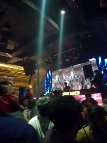 Spotlights cut through the haze at Sugar Factory, with my visuals playing on the screen. It's a full production every time.
