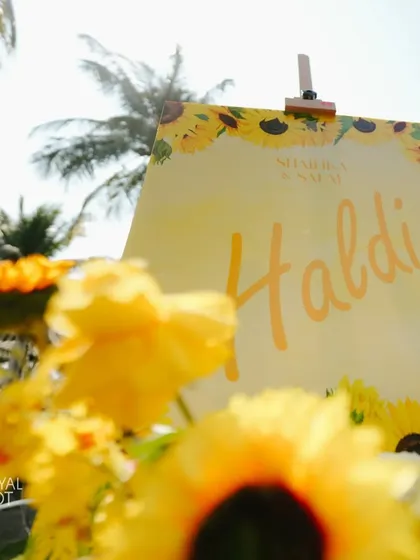 The welcome sign for the Haldi ceremony, surrounded by bright sunflowers.