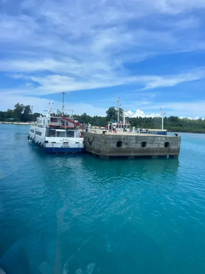 My travels go beyond the ghats. Here's a shot from our Andaman trip, with a ferry docked in the crystal-clear blue waters. Whether it's scuba diving in the ocean or trekking in the mountains, I can plan a custom trip for your group anywhere.