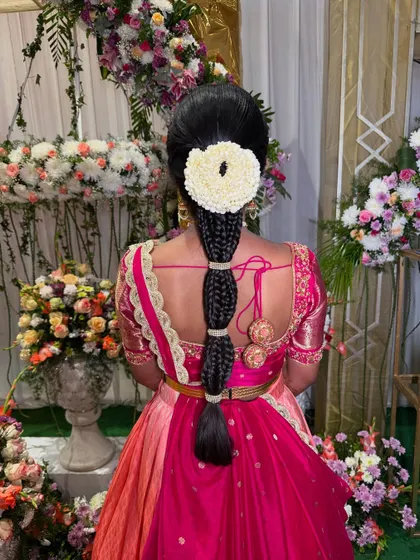 Another look at the segmented braid, showcasing its versatility and elegance. The style is neat, secure, and stays beautiful throughout the event.