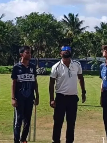 The captains at the coin toss before the match between Magadi Cricket Academy and the Sri Lanka U-15 team, officiated by Ajantha Mendis.