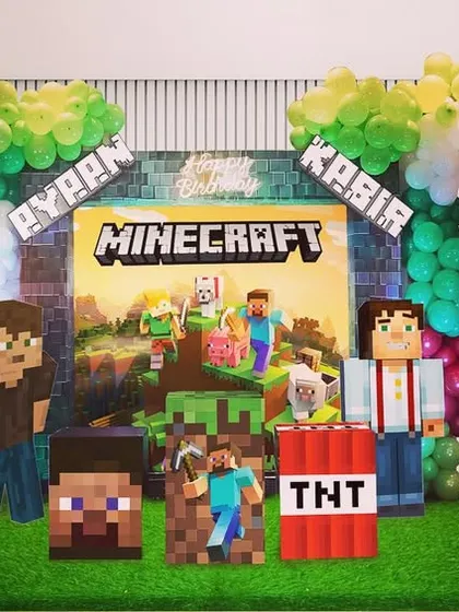A design concept for a Minecraft-themed party. This shows how I can create a blocky, pixelated world with character cutouts like Steve and Alex, TNT props, and custom marquee numbers for the birthday kids.