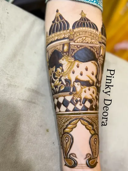 A detailed segment of a Shreenathji-themed bridal mehndi. This part shows the sacred cow and calf in front of the temple, a symbol of purity and devotion.
