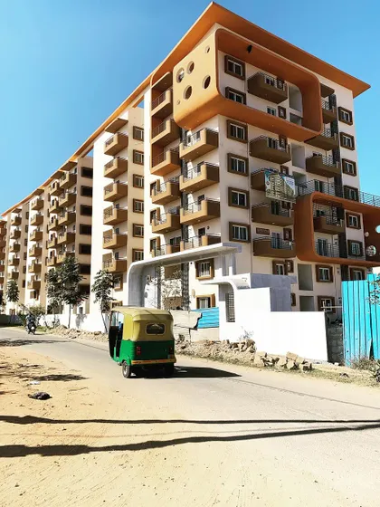 This multi-storied apartment building in Bangalore demonstrates our capability in large-scale residential architecture. The design focuses on creating unique, functional balconies and a visually interesting facade that breaks the monotony of a large structure.
