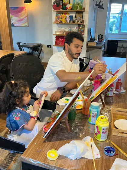 A dad and his little girl spending quality time painting together at a private session. These are the precious moments we love to facilitate.