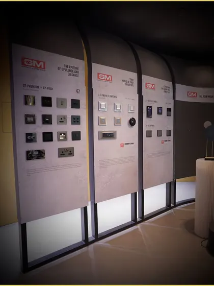 We partner with leading brands like GM to offer a wide selection of high-quality smart switches and controls. This display in our showroom allows clients to see and choose from various premium options.
