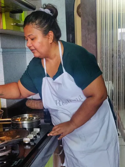 In my element, guiding guests through a recipe. I make sure everyone understands the process, from roasting the spices to the final garnish.