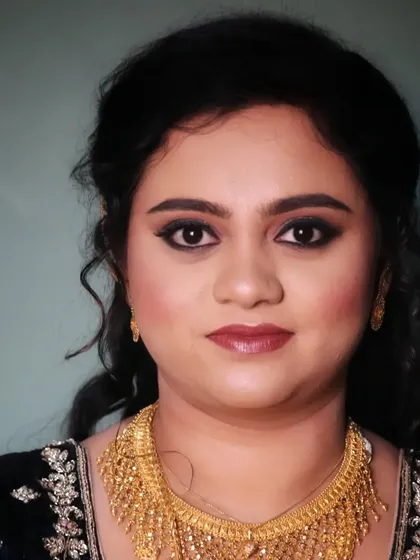A portrait of Afreen from her reception, showcasing her bold smokey eye and flawless complexion.