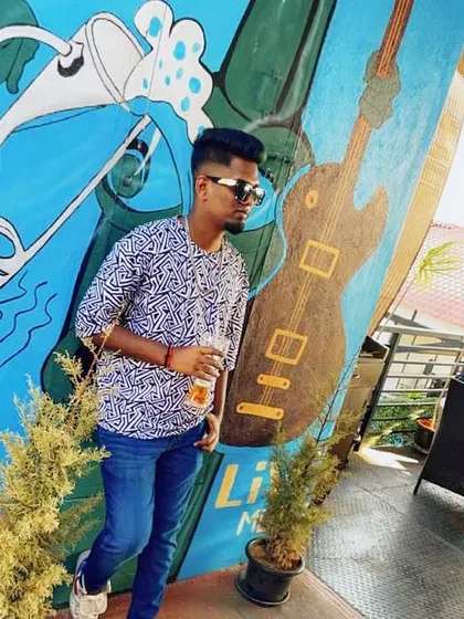 Enjoying a drink on a sunny day. This photo captures a more laid-back moment, showing my personality outside the club.
