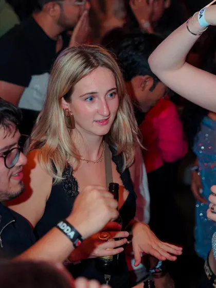The crowd at Bombay Adda is always a mix of locals and travelers, all connected by the music. It's my job to find the tracks that get everyone moving.