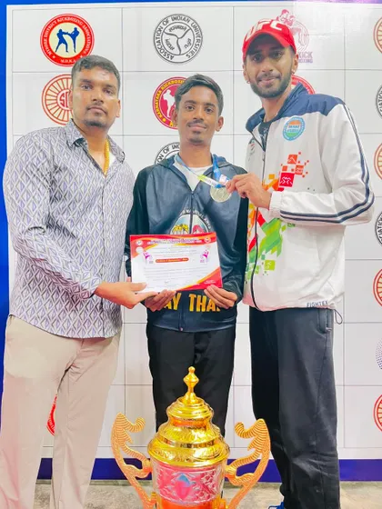 This fighter earned his medal through relentless training. Pictured here with his certificate at the Karnataka State Kickboxing Championship.