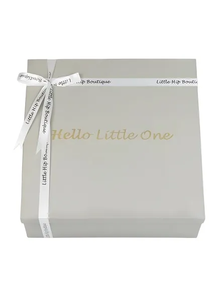 A clean, e-commerce shot of a 'Hello Little One' gift box, tied with a branded ribbon. This focuses on the premium packaging.