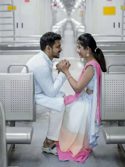 A romantic moment inside the train, holding hands and looking at each other, creating a story of a shared journey.