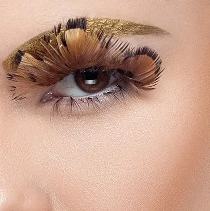 An extreme close-up of the eye with gold and feather makeup. This shot demonstrates my ability to capture minute details with precision, essential for cosmetic and beauty campaigns.