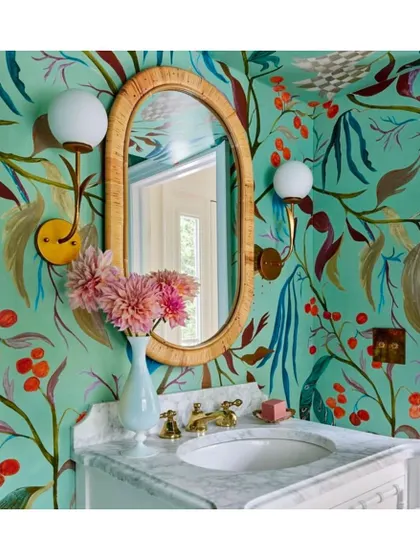 Featuring 18th-century Indian-inspired trees, fruits, and foliage, the Lucille wallpaper from La Maison Pierre Frey is the perfect choice to dress up a powder room. Its vibrant, hand-painted feel adds a layer of bespoke artistry and charm.