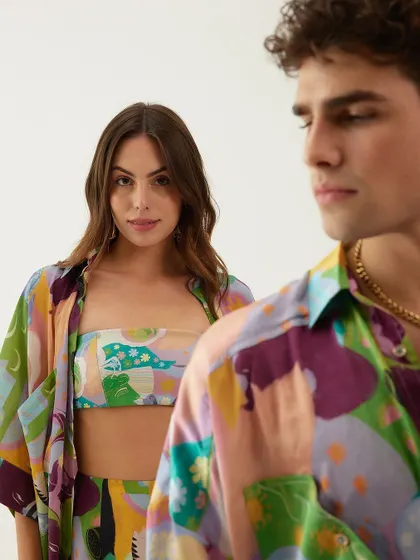 A shot from Tizzi's swimwear campaign, featuring both male and female resort wear for a couples' vacation theme.