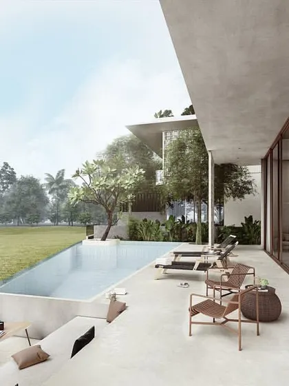 The patio of a Pavilion home, where the interior living space extends outwards towards the pool. This covered outdoor area provides a comfortable space to enjoy the panoramic views of the surrounding fields.