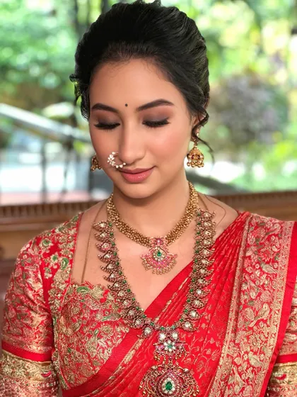 A close-up of the soft smokey eye and traditional nose ring, a perfect blend of modern and classic styles.