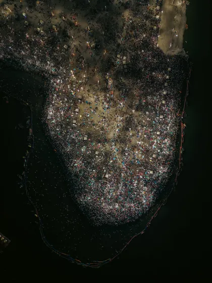 A detailed top-down photograph of the crowd at the Mahakumbh. This high-resolution aerial shot allows you to see the density of the gathering, capturing a moment of collective faith on an epic scale.