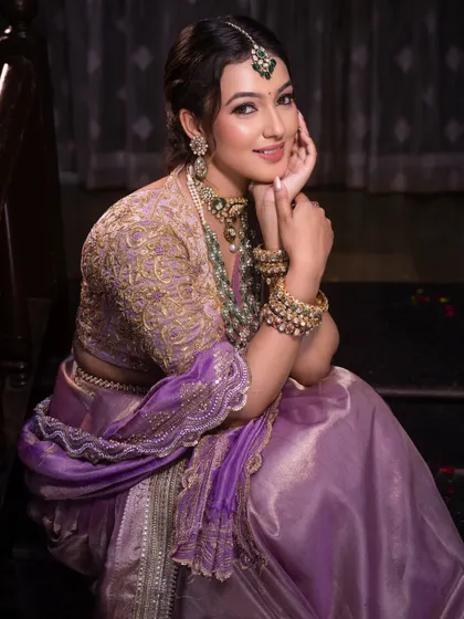 A soft and serene portrait, highlighting the gentle makeup and the bride's calm and happy demeanor.