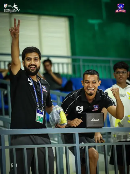 Our management team celebrating in the stands after the semi-final win.