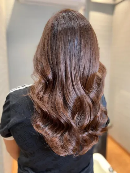 Melting into a gorgeous mahogany brown. This shade has rich red and brown undertones, creating a deep and luxurious color.