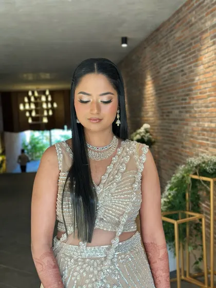 A close-up of the reception look. I used a champagne shimmer on the eyes and a soft contour to create a look that is both glamorous and sophisticated.